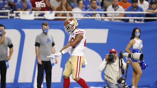 Sep 12, 2021; Detroit, Michigan, USA; San Francisco 49ers running back Elijah Mitchell (25) celebrates after scoring a touchdown during the second quarter against the Detroit Lions at Ford Field. Mandatory Credit: Raj Mehta-USA TODAY Sports